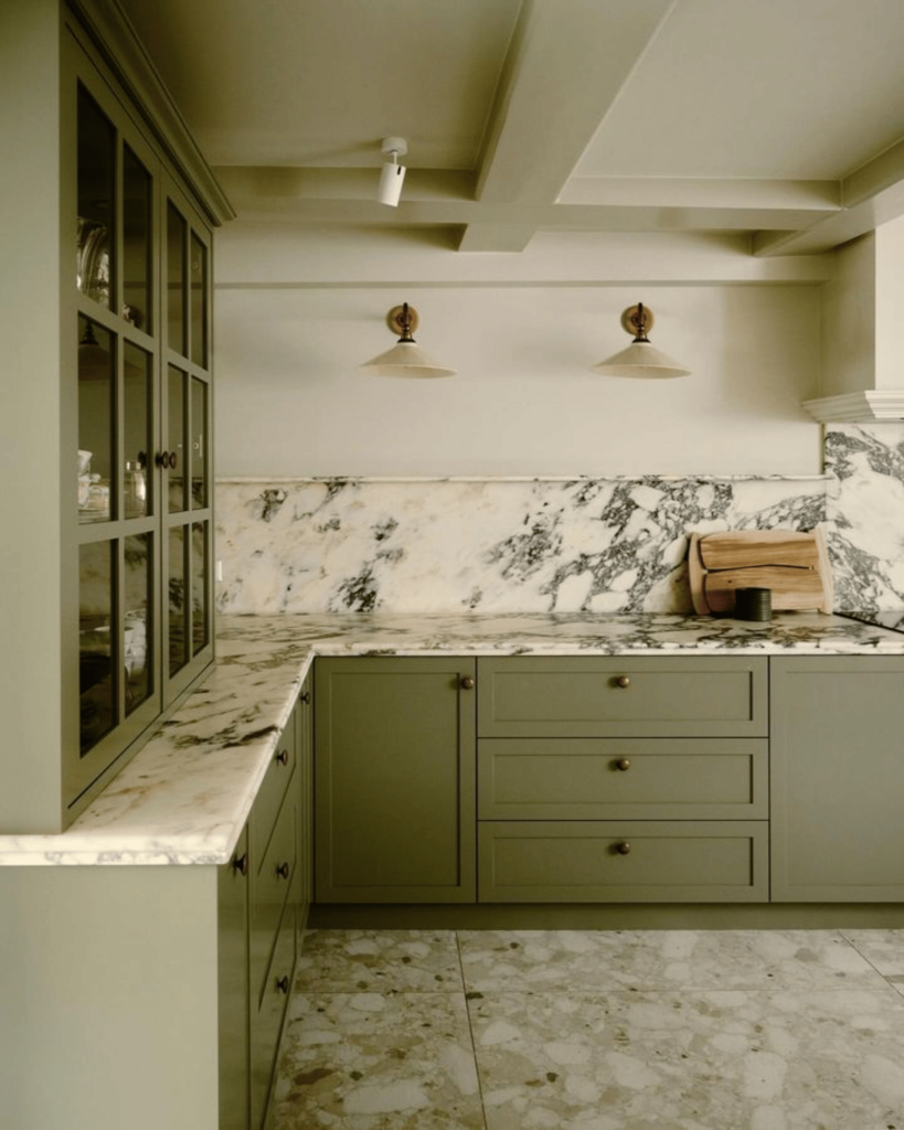 old world green and marble kitchen design by 2711 Interiors