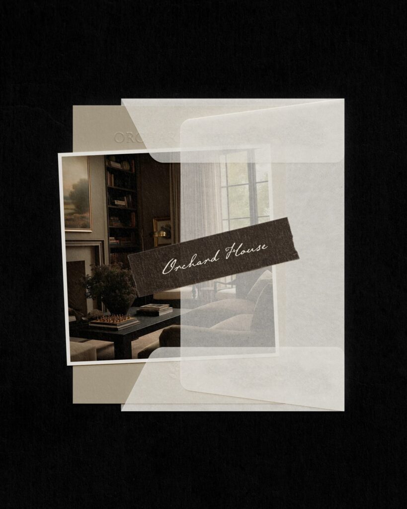 Detail of Orchard House Interiors branding materials. A vellum overlay effect reveals a traditional interior design project featuring dark wood tones and soft linen window treatments.